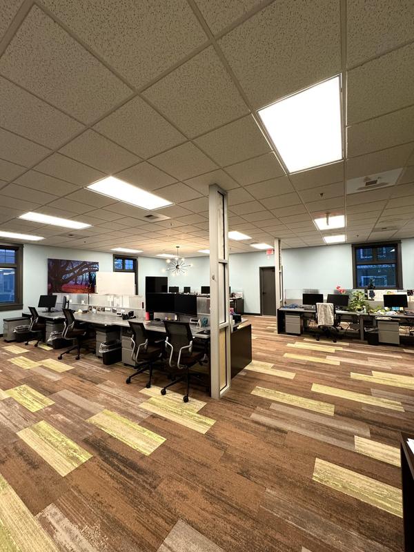 Open-plan office after service, desks and floors clear