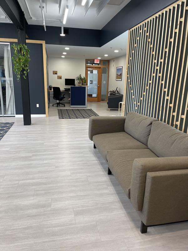Reception area with timber screen and lounge seating