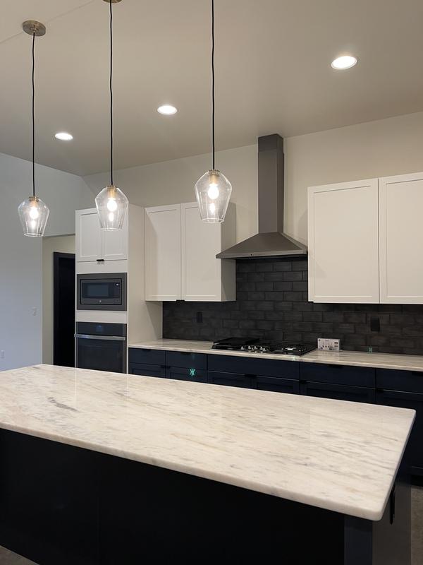 Marble island under glass pendants